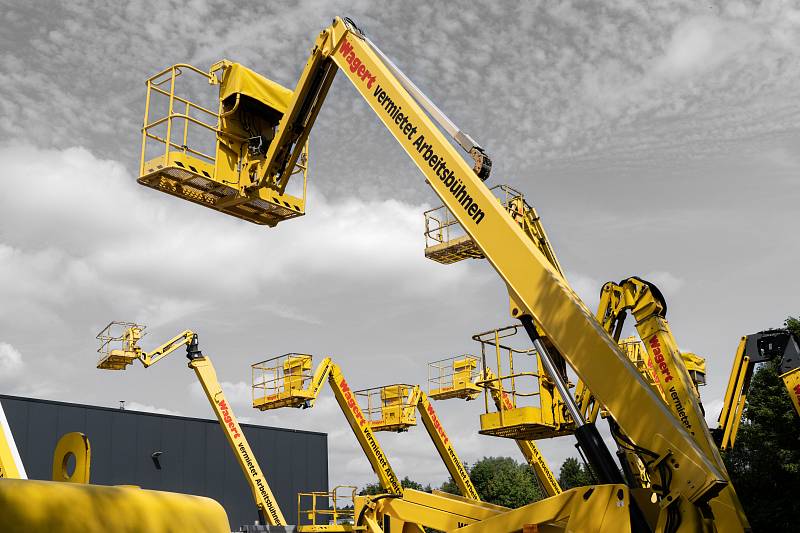 Several extended Wagert working platforms with the sky in the background